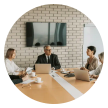 Government authority stakeholders meeting around a boardroom table
