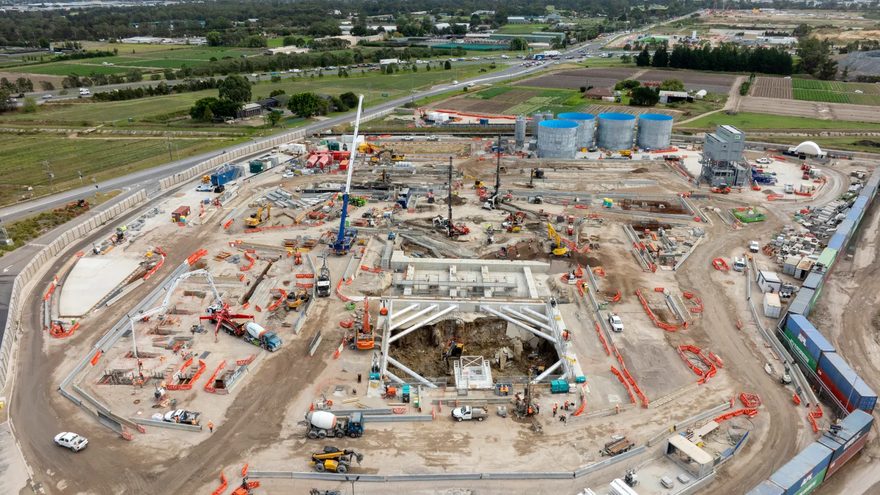 Aerial view of an open-cut station box excavation on a rural construction site