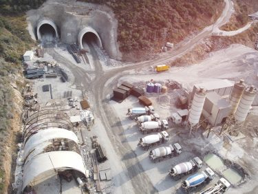 Aerial view of equipment operating around a tunnel portal