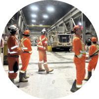 Site team members in safety workwear on the operating floor