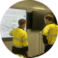 Leadership team reviewing operational dashboards on a screen