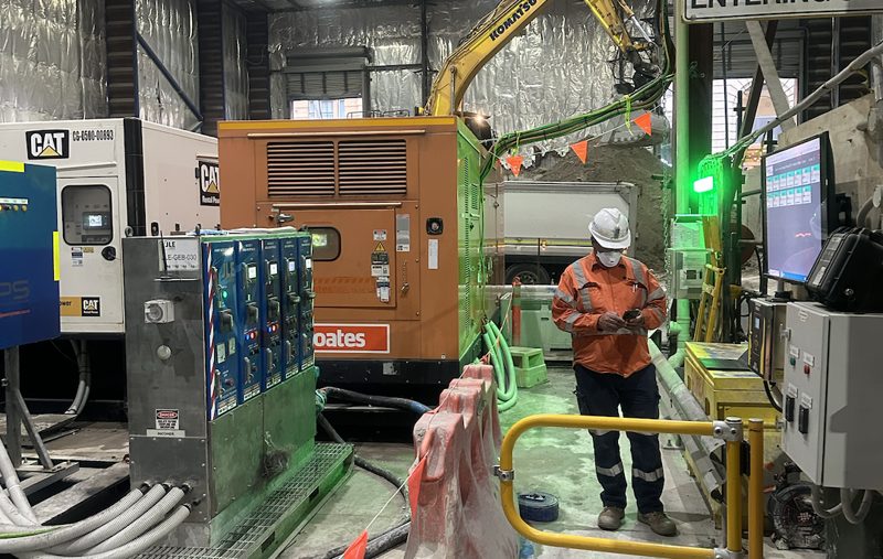 Contractor reviewing reporting screens on site