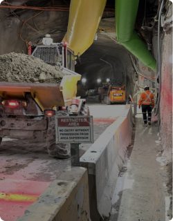 Tunnelling works with ventilation ducting in a confined underground environment
