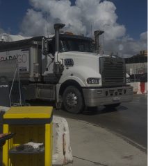 Haul truck moving through a surface work area