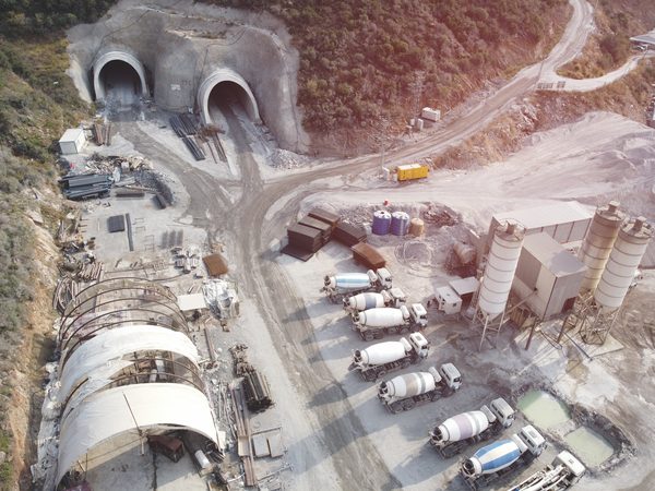 Haul trucks operating in an open-pit mine
